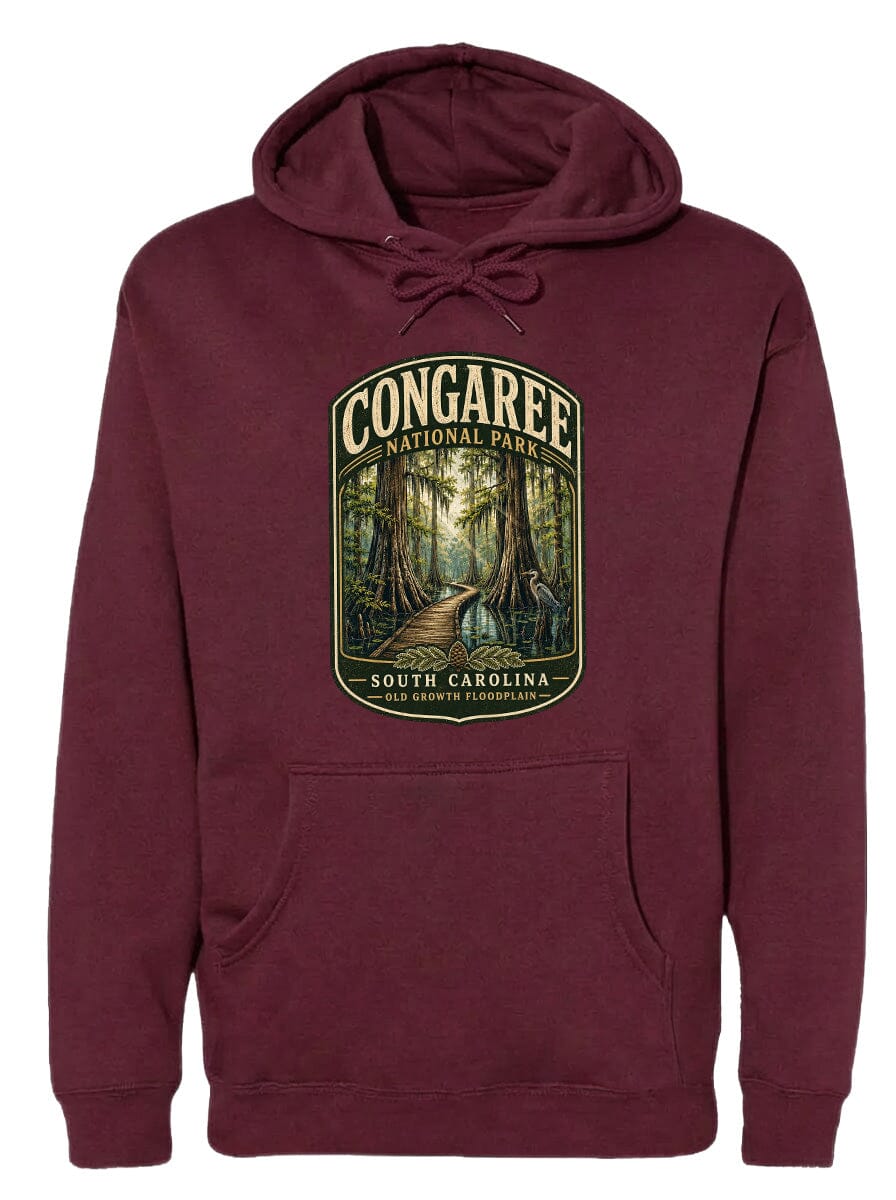 A burgundy hoodie with a graphic design depicting a forest scene, specifically the Congaree National Park in South Carolina.