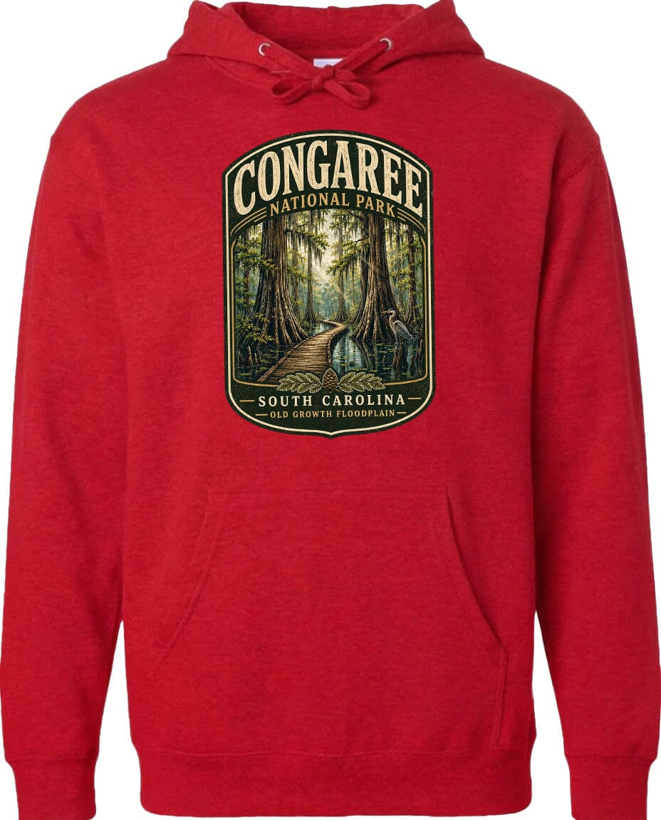 A red hoodie with a graphic design depicting a forest path leading through Congaree National Park in South Carolina.