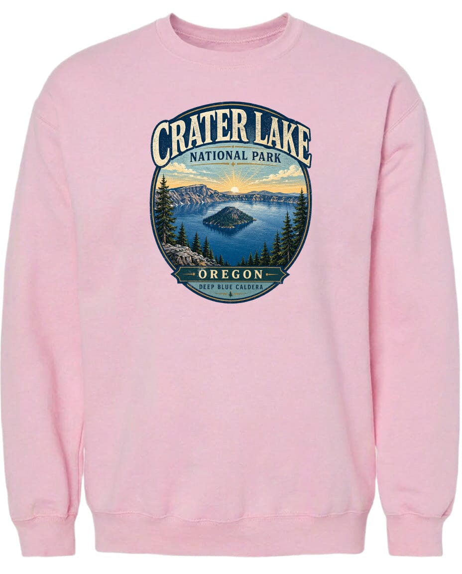 A pink sweatshirt with a graphic design depicting Crater Lake National Park in Oregon.