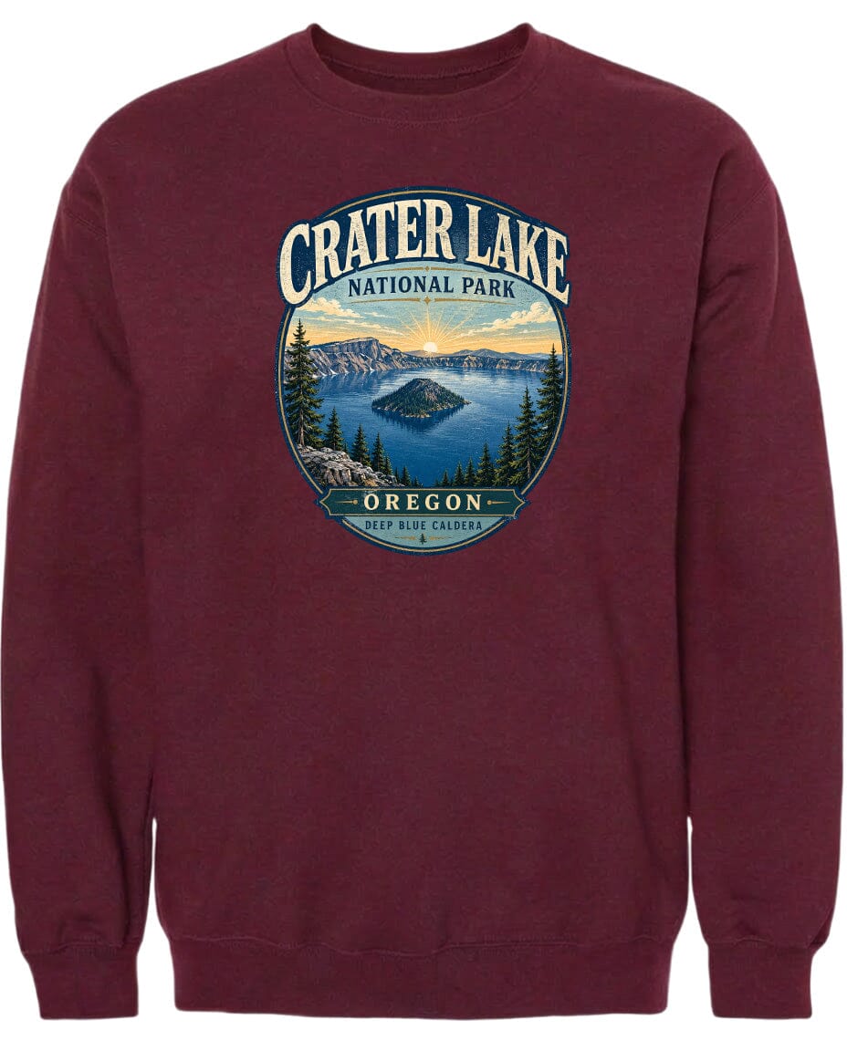 A maroon sweatshirt with a graphic design depicting Crater Lake National Park in Oregon.