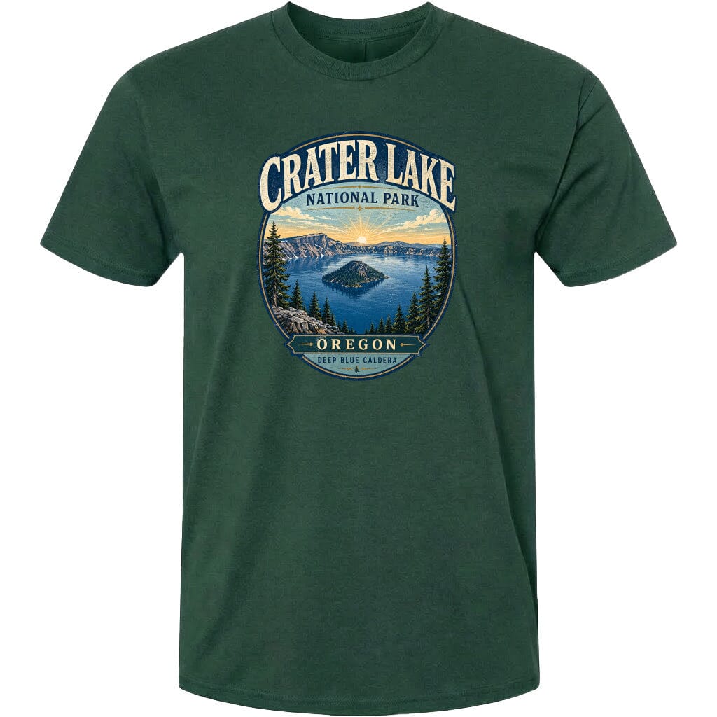 A green t-shirt with a graphic design depicting Crater Lake National Park in Oregon, featuring a scenic landscape with a lake, mountains, and pine trees.