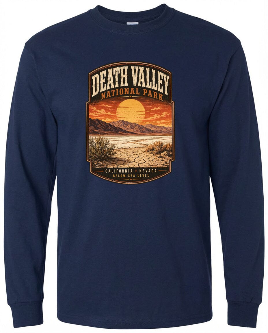 A long-sleeved navy blue t-shirt with a graphic design depicting a desert landscape with mountains, a sunset, and a desert plant.