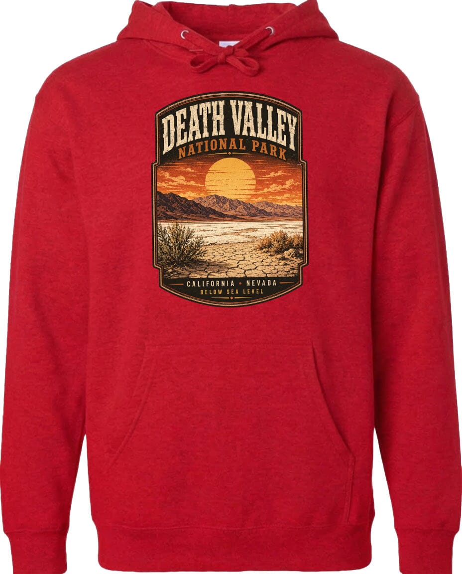 A red hoodie with a graphic design depicting a desert landscape with mountains, a sunset, and a cactus plant.