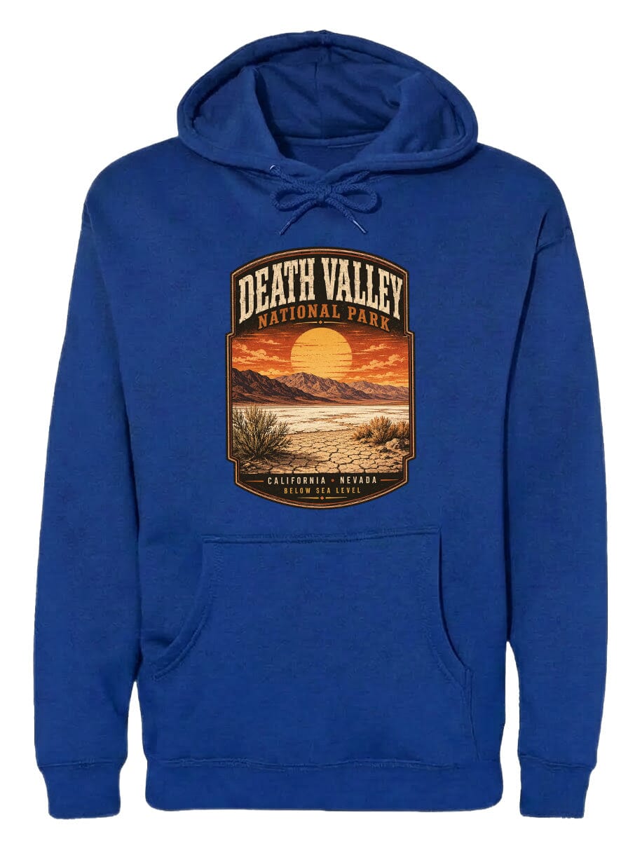 A blue hoodie with a graphic design depicting Death Valley National Park, including a sunset over the mountains and desert landscape.
