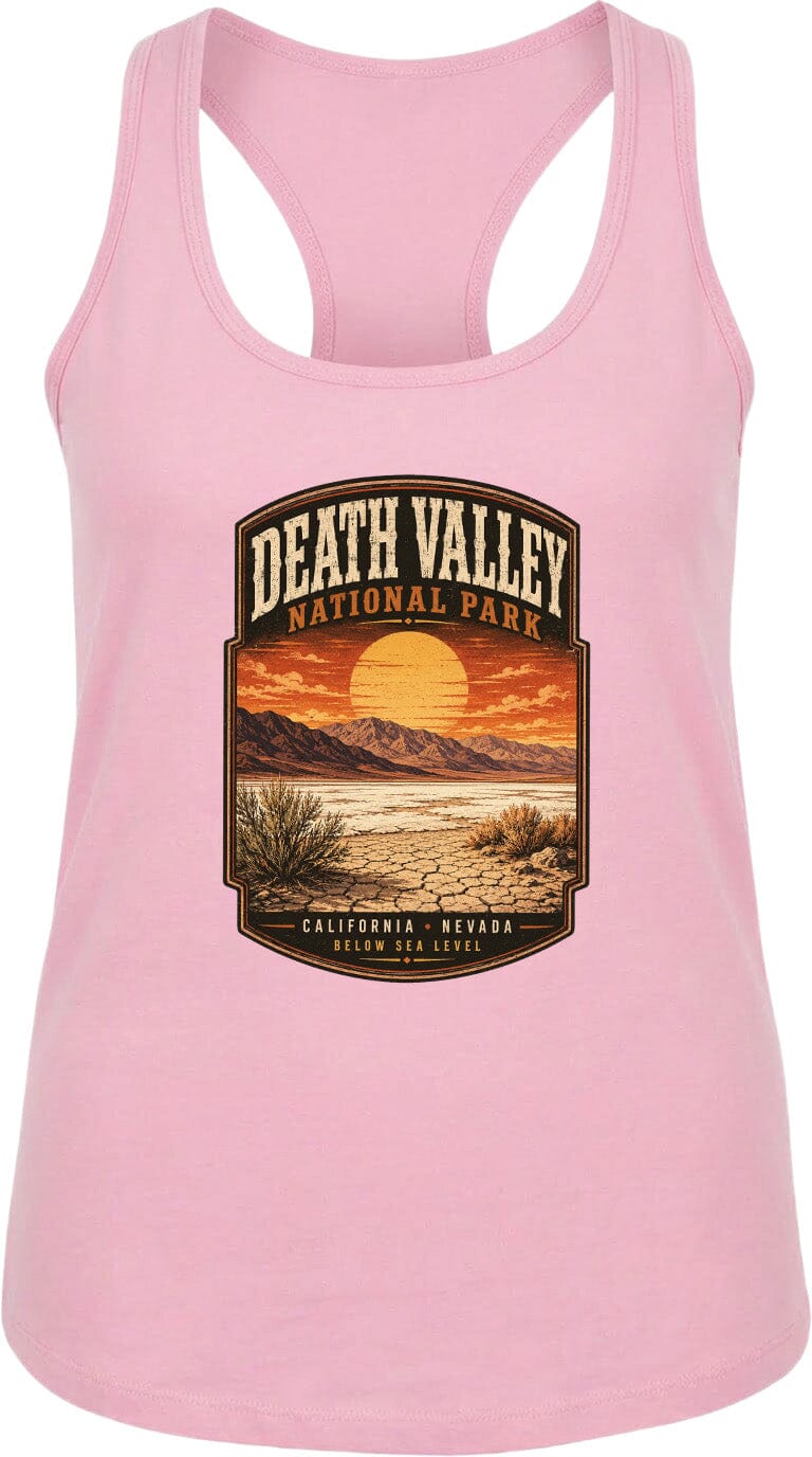 A pink tank top with a graphic design depicting Death Valley National Park, including a sunset over the desert landscape.