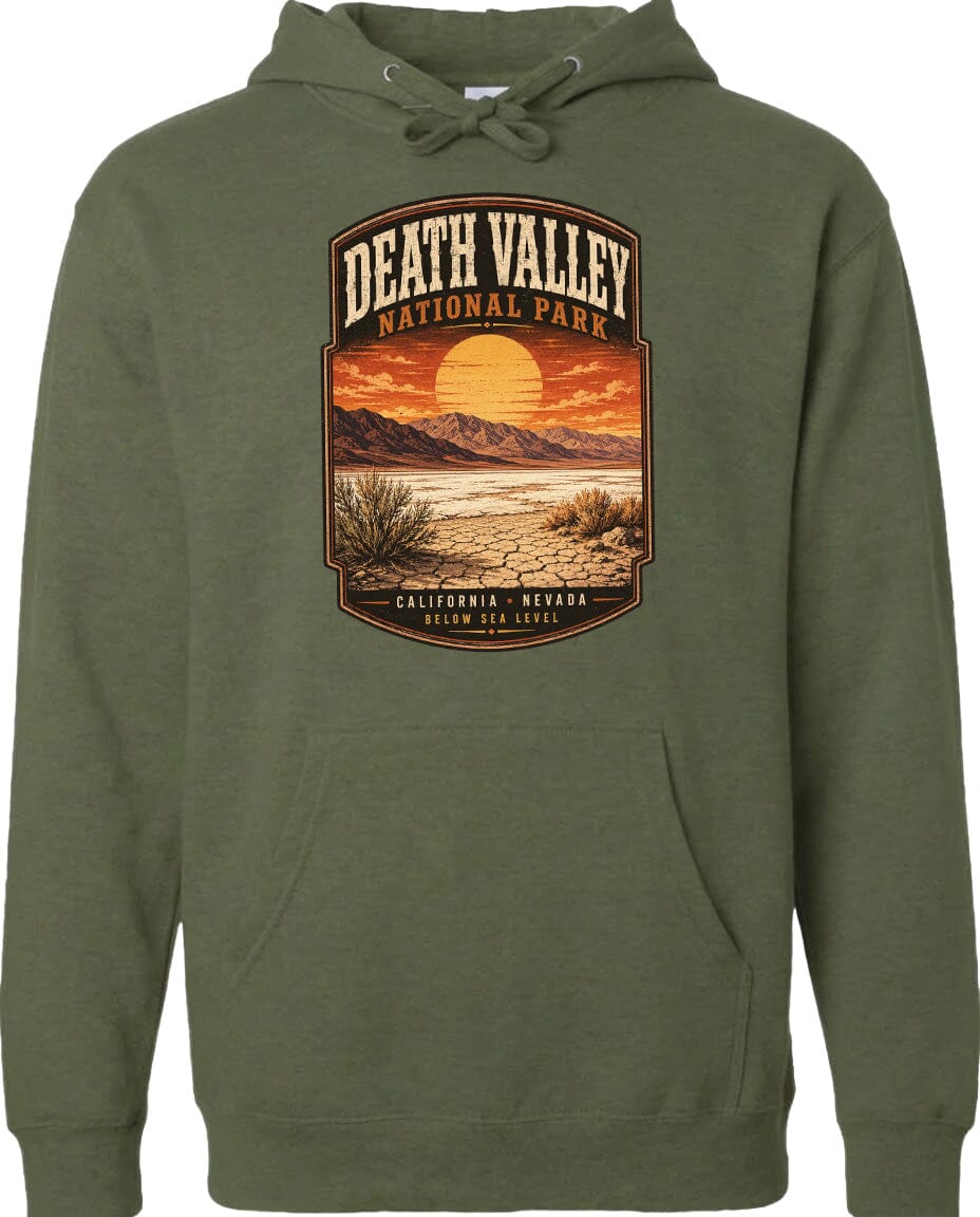 A hoodie with a graphic design depicting Death Valley National Park, including a desert landscape with mountains, a sunset, and a sunflower.