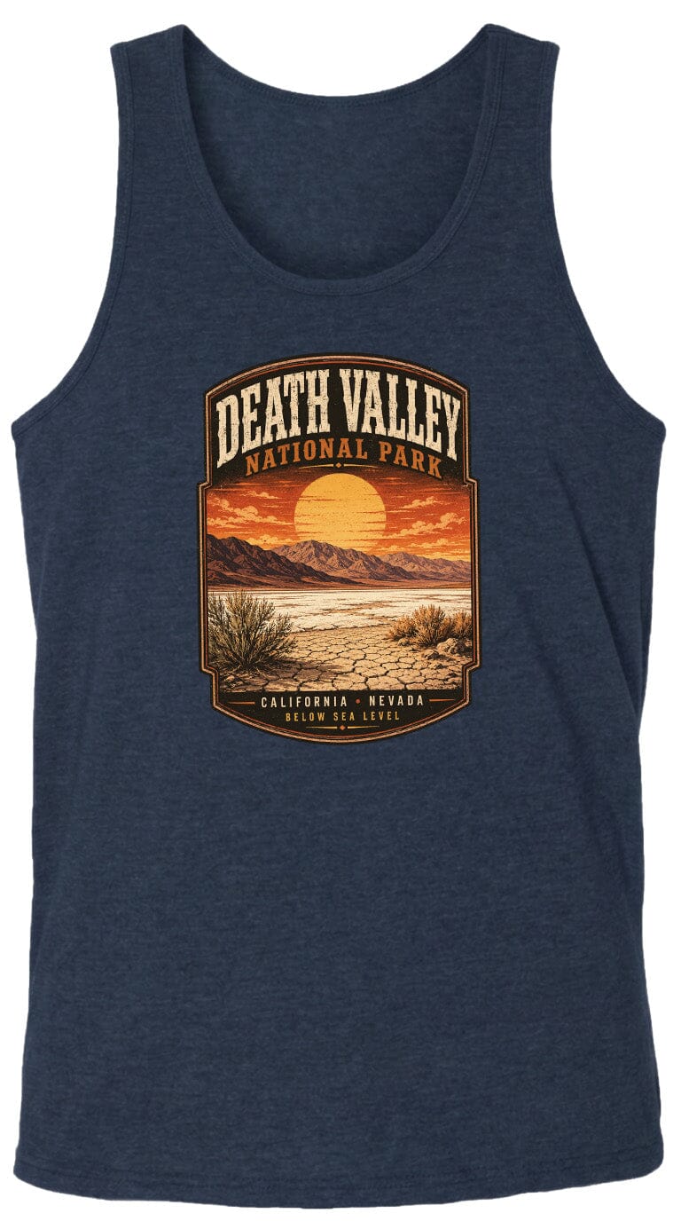 A graphic design on a dark blue tank top depicting a desert landscape with mountains and a sunset in the background.
