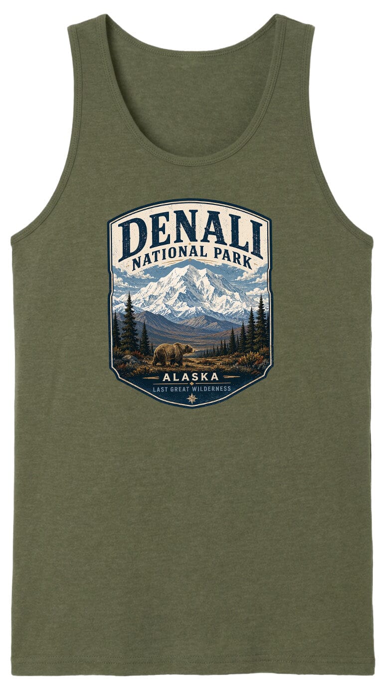 A green tank top with a graphic design depicting a bear in Alaska National Park, surrounded by mountains and pine trees.