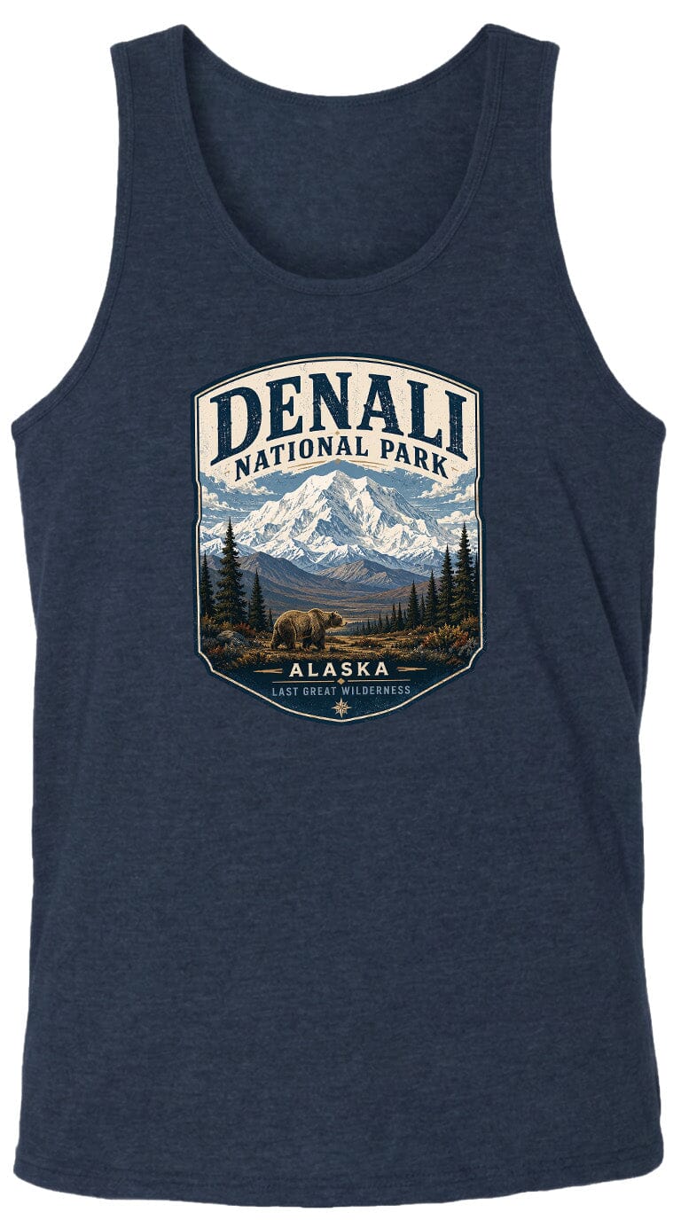A graphic design on a dark blue tank top featuring a mountain landscape with a bear, surrounded by text that says "DENALI NATIONAL PARK ALASKA LAST GREAT WILDERNESS".