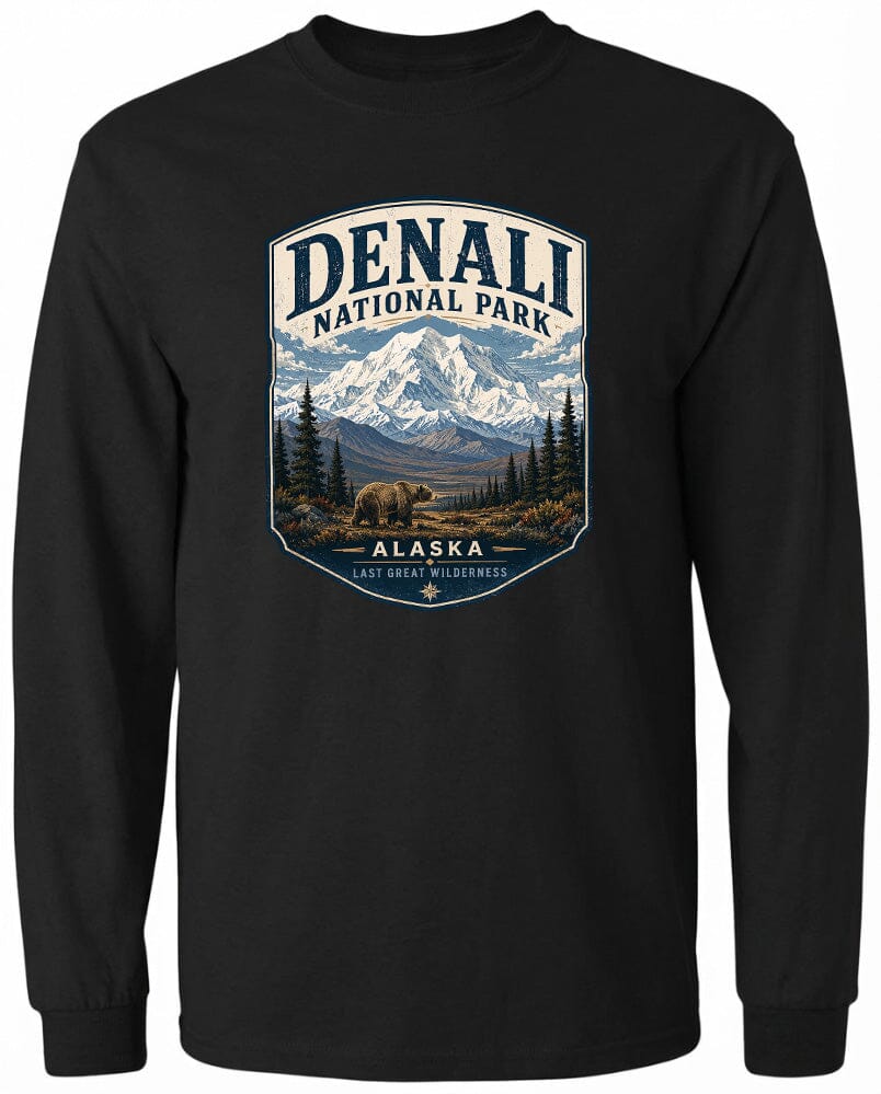 A black long-sleeved t-shirt with a graphic design depicting a mountain landscape with a bear in the foreground, surrounded by pine trees and mountains.
