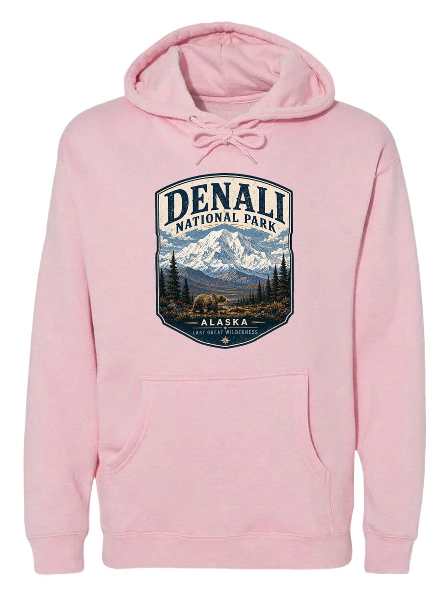 A pink hoodie with a graphic design depicting Denali National Park and Alaska.