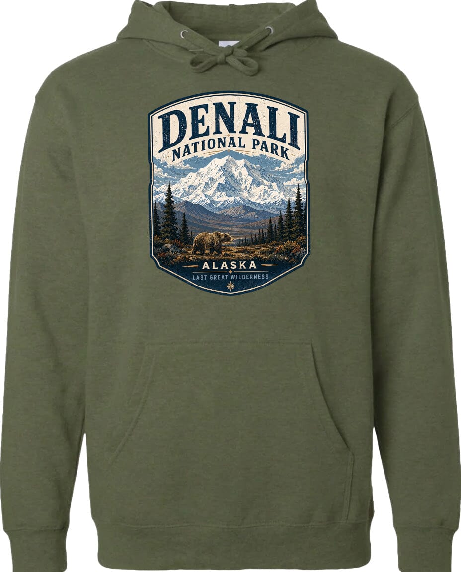 A hoodie with a graphic design featuring a mountain landscape and a bear, with the text "DENALI NATIONAL PARK ALASKA" prominently displayed.