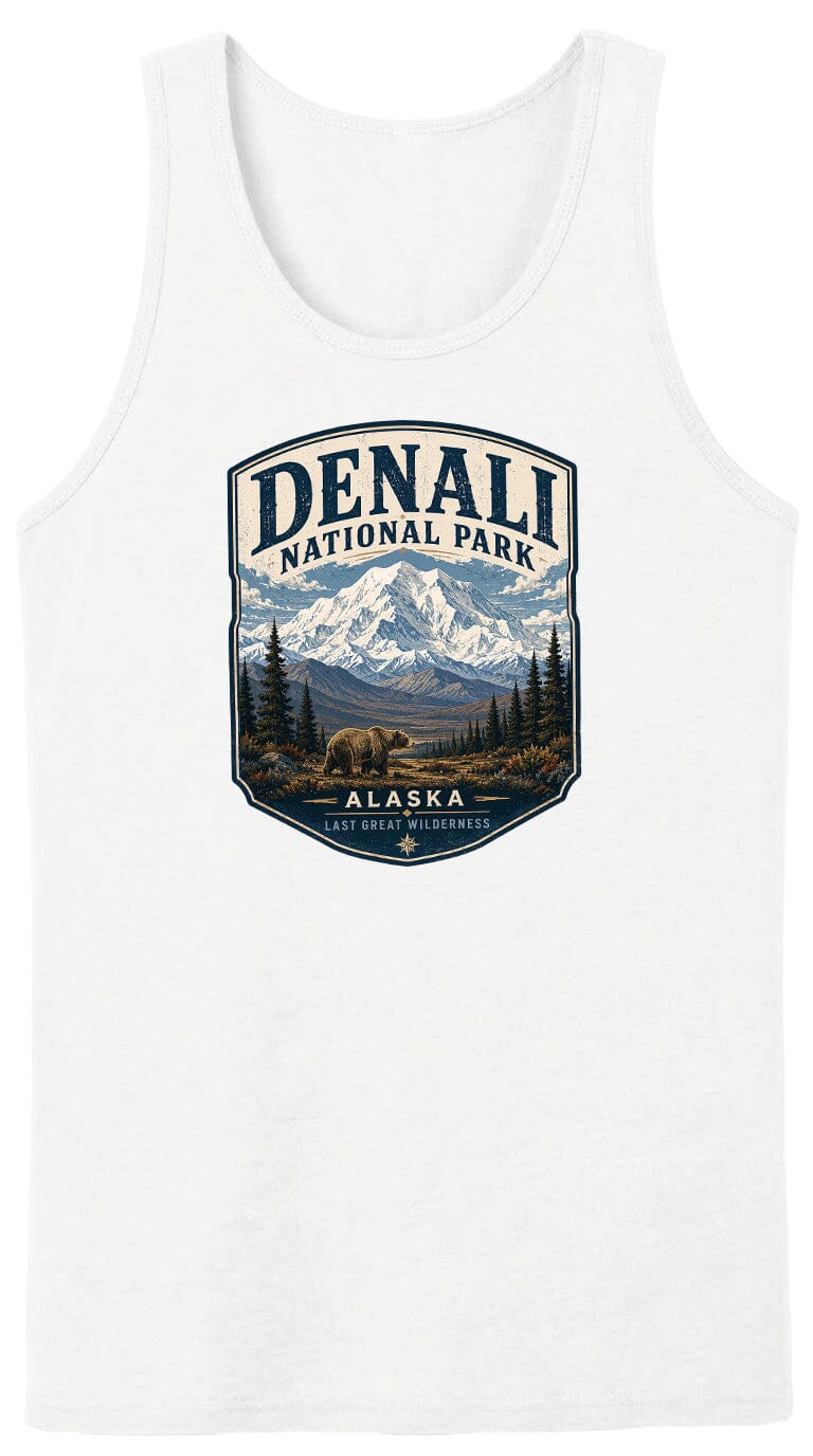 A white tank top with a graphic design featuring a mountain landscape with a bear in the foreground, surrounded by pine trees and the text "DENALI NATIONAL PARK ALASKA LAST GREAT WILDERNESS".