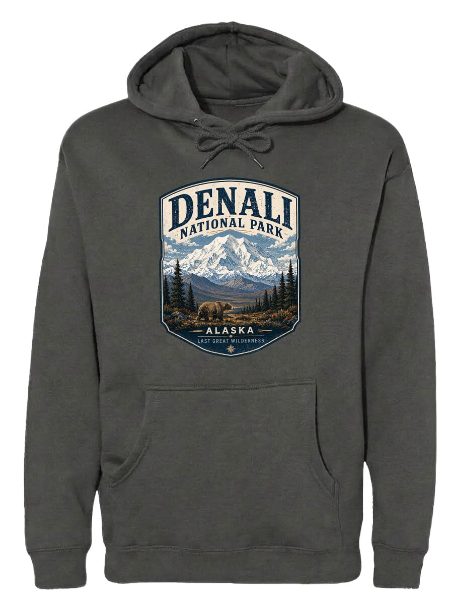 A gray hoodie with a graphic design featuring a mountain landscape and the text "DENALI NATIONAL PARK ALASKA LAST GREAT WILDERNESS".