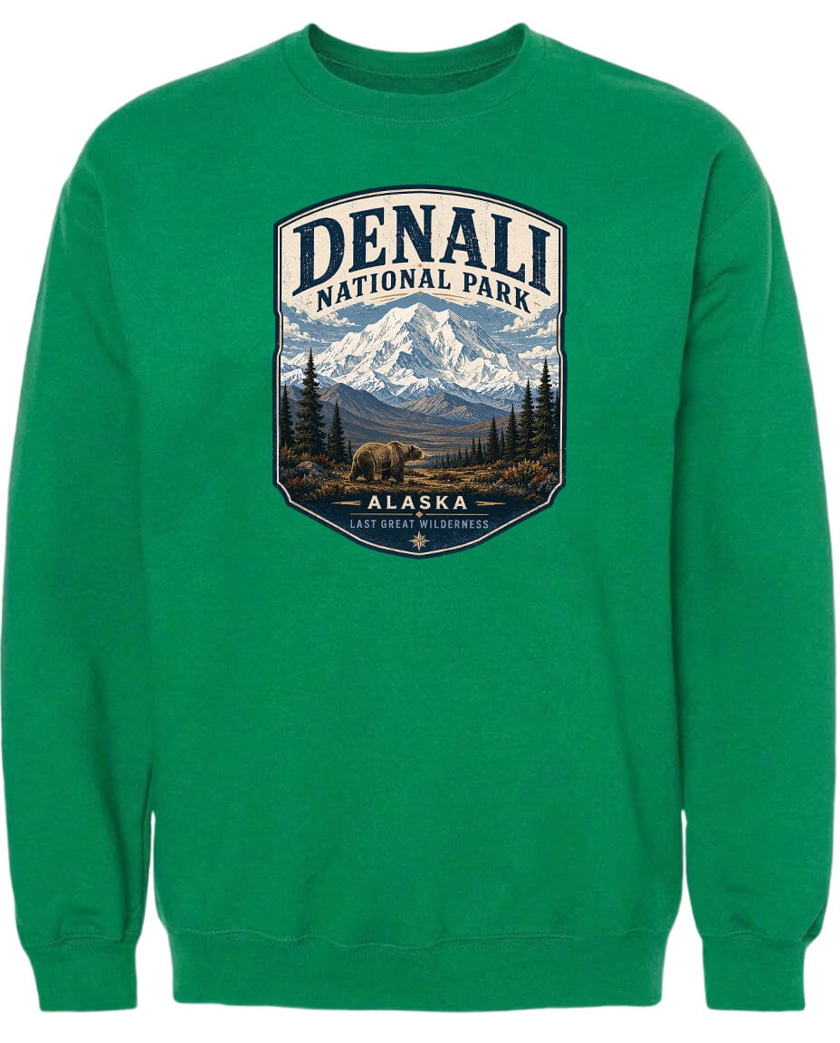 A green sweatshirt with a graphic design depicting Denali National Park in Alaska, featuring a mountain landscape with a bear in the foreground.