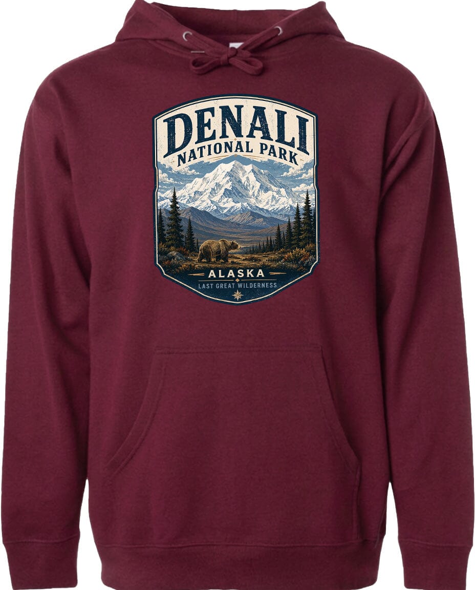 A burgundy hoodie with a graphic design depicting Denali National Park and Alaska.