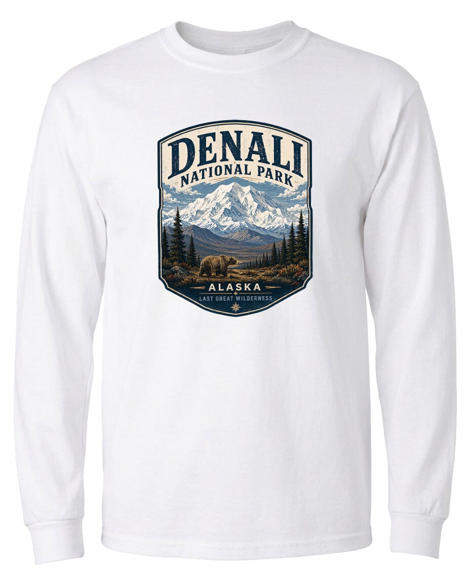 A white long-sleeved t-shirt with a graphic design depicting Denali National Park in Alaska, featuring a bear and a mountain landscape.