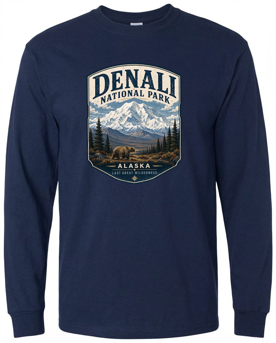 A long-sleeved navy blue t-shirt with a graphic design depicting a mountain landscape with a bear in the foreground, surrounded by pine trees and mountains.