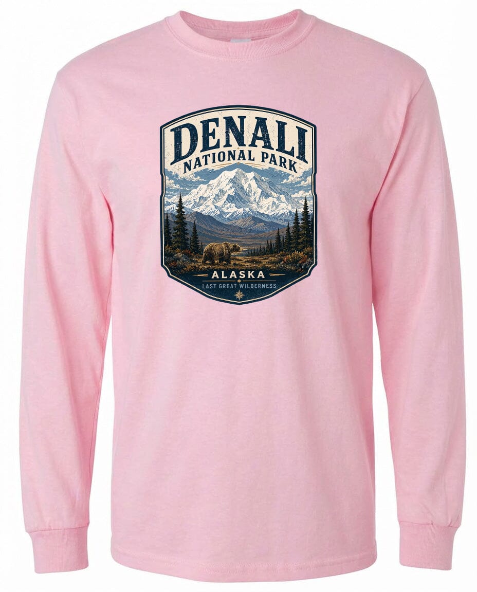 A pink long-sleeved t-shirt with a graphic design depicting Denali National Park and Alaska.