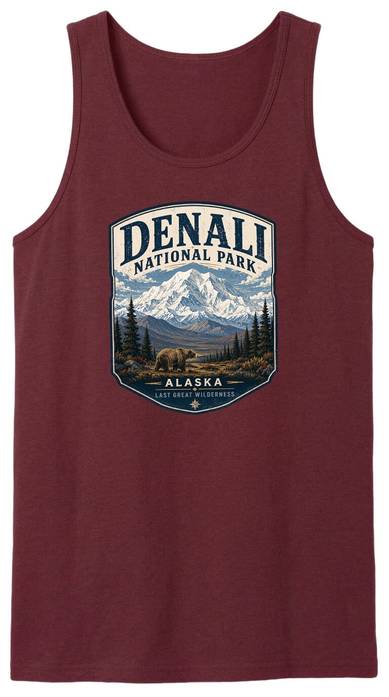 A red tank top with a graphic design depicting a mountain landscape with a bear in the foreground, surrounded by pine trees and mountains.