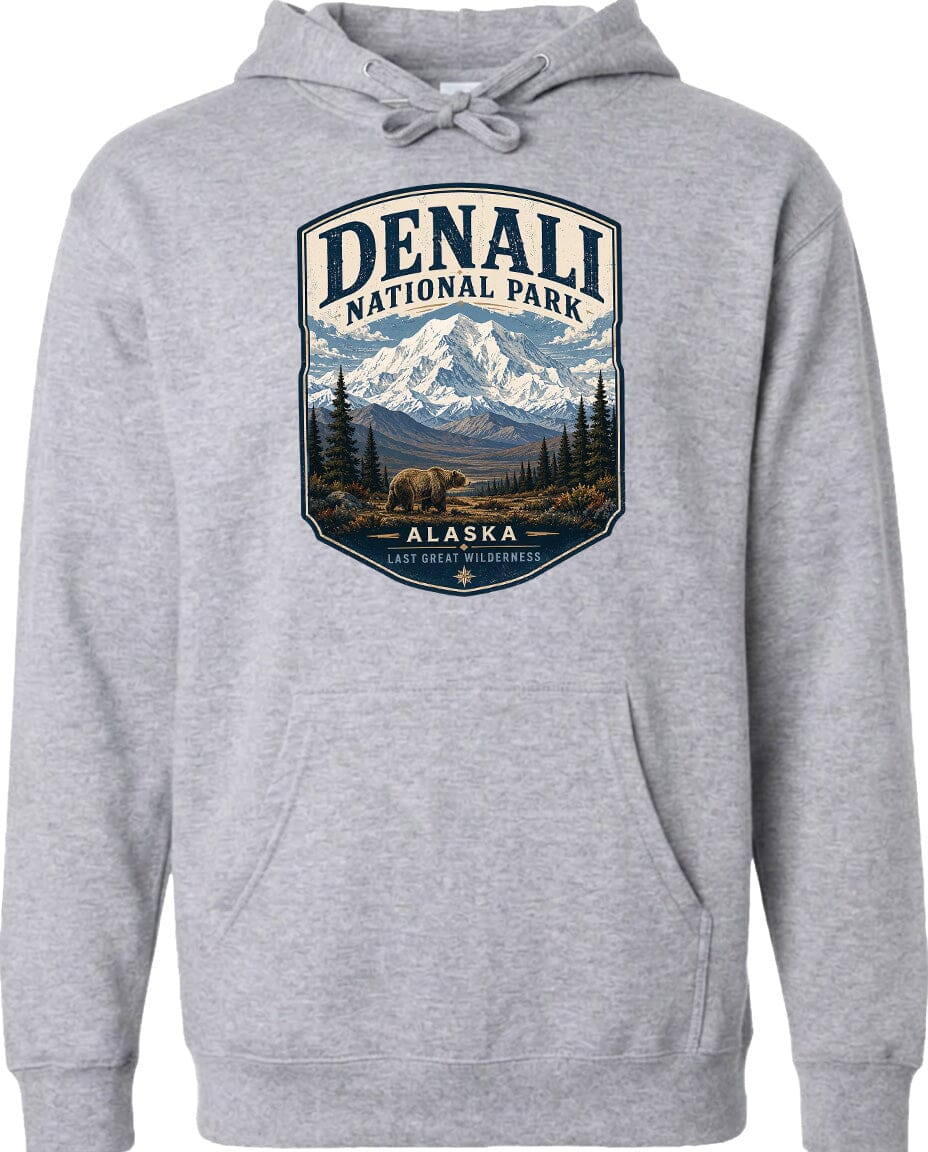 A gray hoodie with a graphic design depicting Denali National Park in Alaska, featuring a mountain landscape with a bear in the foreground.