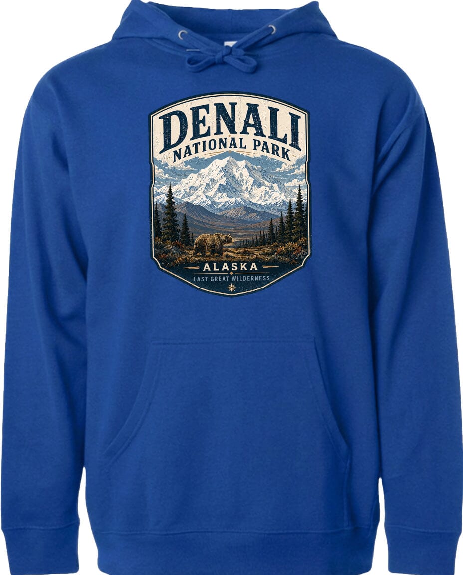 A blue hoodie with a graphic design depicting a mountain landscape and bears, along with the text "DENALI NATIONAL PARK ALASKA LAST GREAT WILDERNESS".