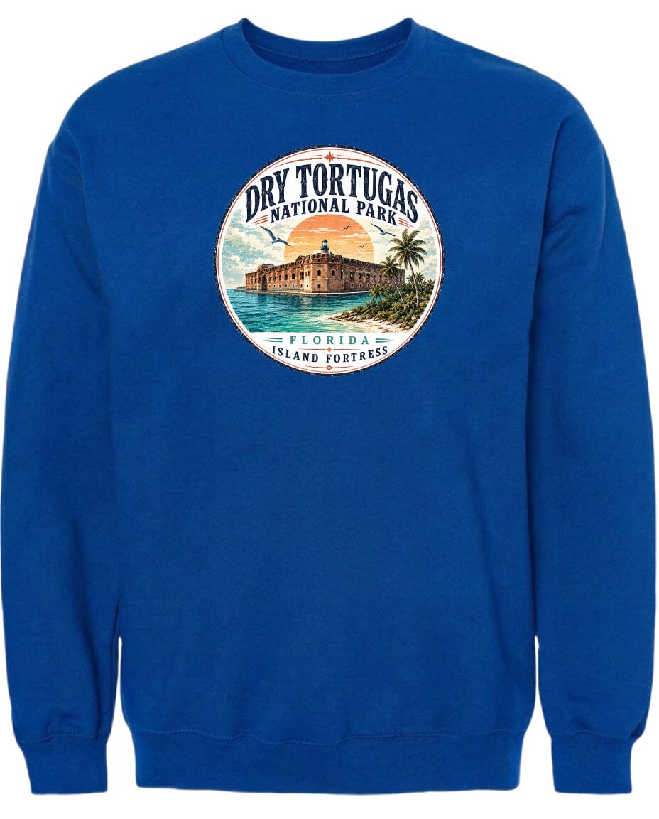 A blue sweatshirt with a circular graphic design featuring a building and palm trees, along with the text "Dry Tortugas National Park, Florida Island Fortress".