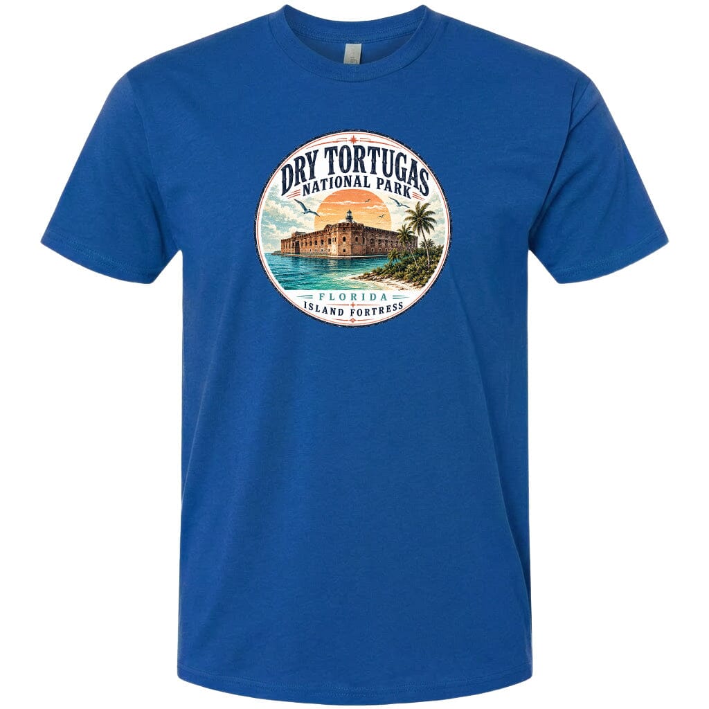 A blue t-shirt with a circular graphic design featuring a tropical beach scene with a building and palm trees.