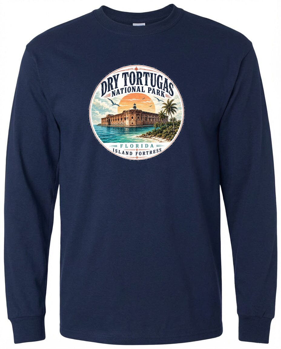 A navy blue long-sleeved shirt with a circular graphic design featuring a building, palm trees, and a sunset over a body of water, representing Dry Tortugas National Park in Florida.