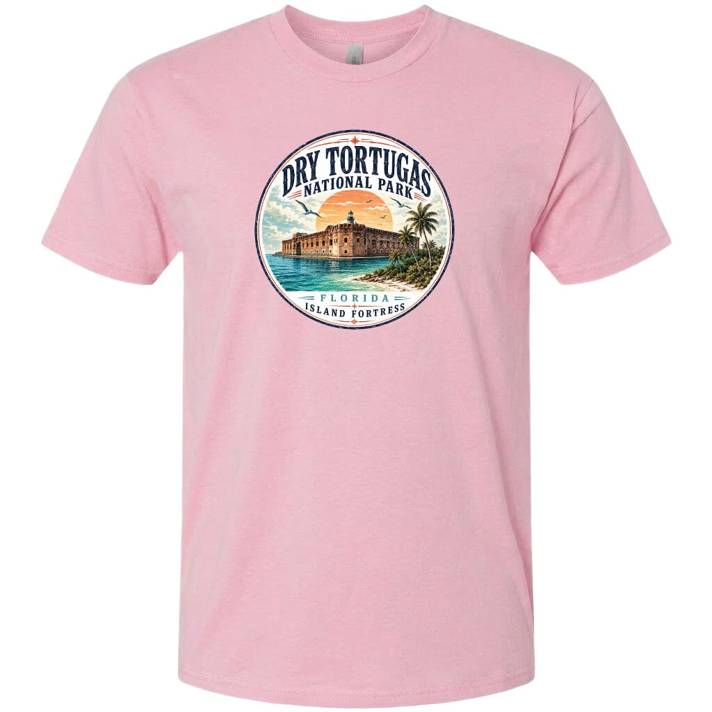 A pink t-shirt with a circular graphic design featuring a tropical beach scene with a building and palm trees.