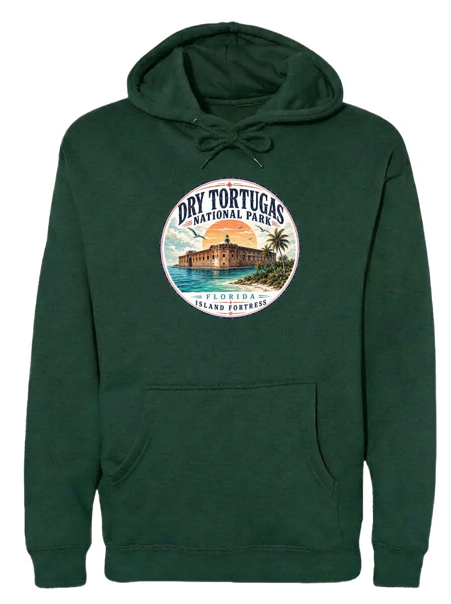 A green hoodie with a circular emblem featuring a tropical island with a castle, surrounded by palm trees and a sunset.