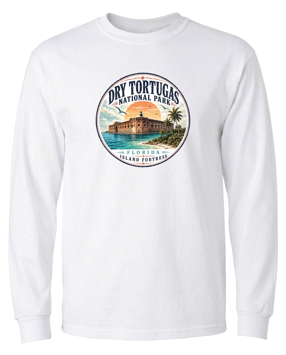 A white long-sleeved t-shirt with a circular design featuring a tropical island with a lighthouse, palm trees, and a sunset.