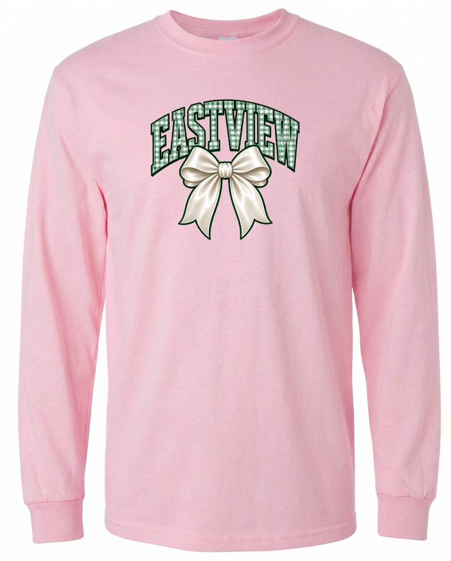 A pink long-sleeved t-shirt with a graphic design on the front. The design features a white bow and the word "EASTVIEW" written in green letters.