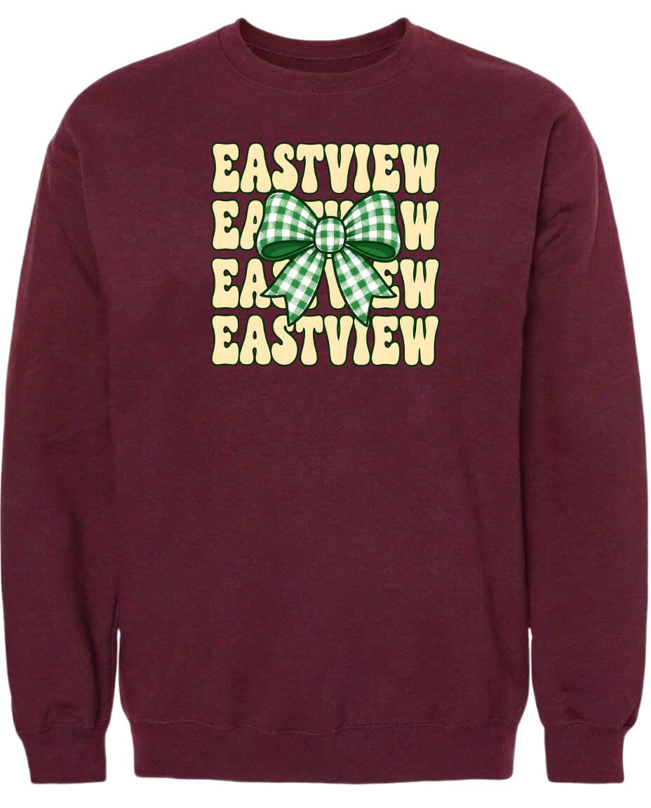 A burgundy sweatshirt with a graphic design featuring a green and white checkered bow on the front.