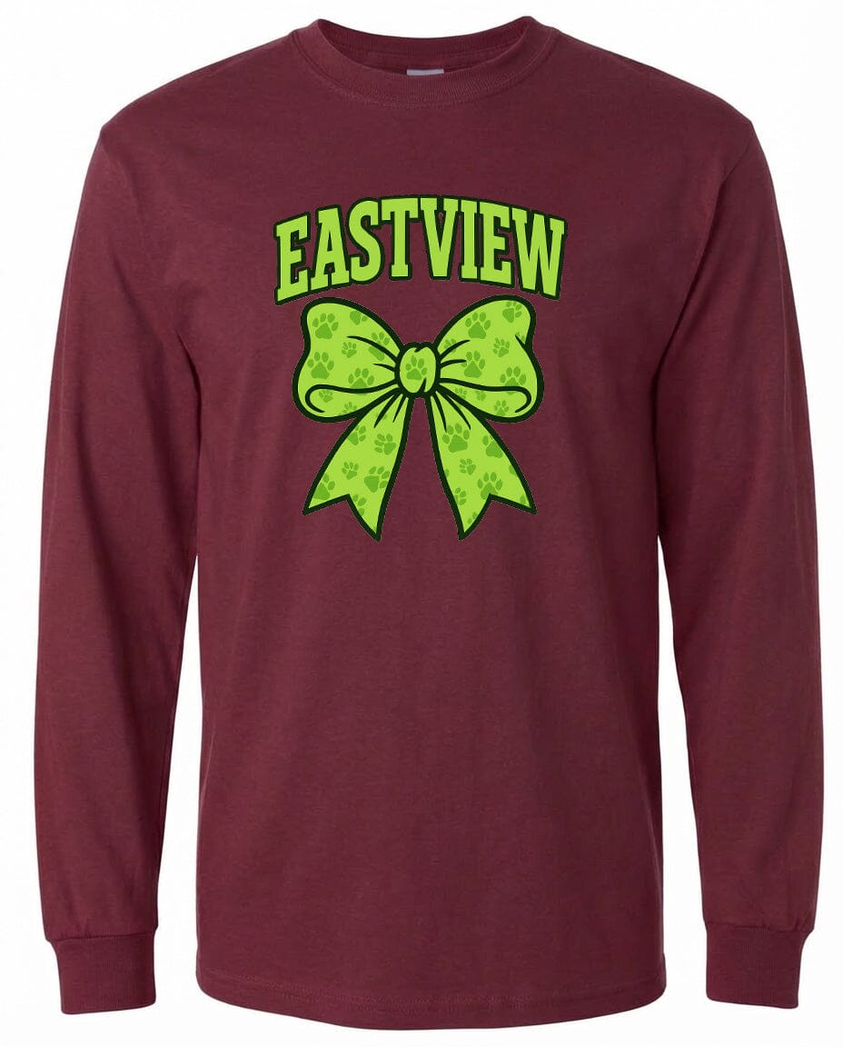 A burgundy long-sleeved t-shirt with a graphic design featuring a green bow and paw prints.