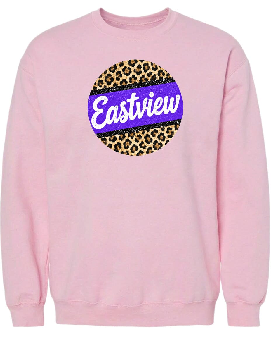 A pink sweatshirt with a large circular logo on the front. The logo features a leopard print design with a purple border.