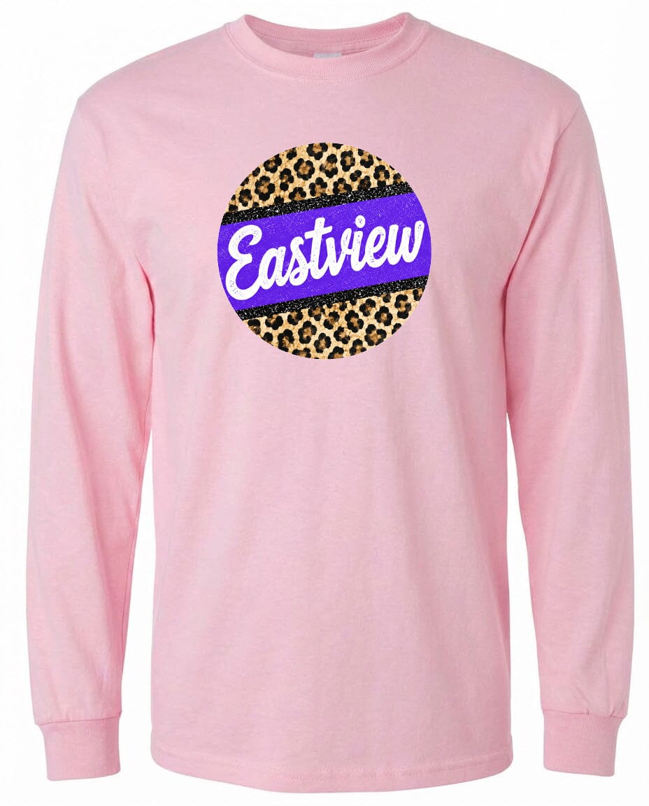 A pink long-sleeved shirt with a circular logo on the front. The logo features a leopard print design with a purple border.