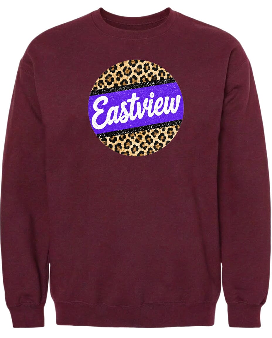 A burgundy sweatshirt with a large circular logo on the front. The logo features a leopard print design with a purple border and the word "Eastview" written in white cursive text.