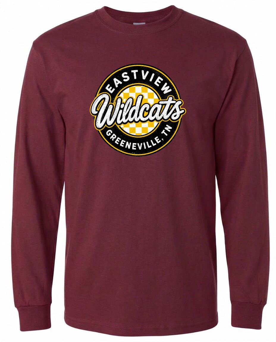 A burgundy long-sleeved t-shirt with a circular logo on the front. The logo features the text "EASTVIEW Wildcats" in a stylized font, surrounded by a yellow and black checkered pattern.