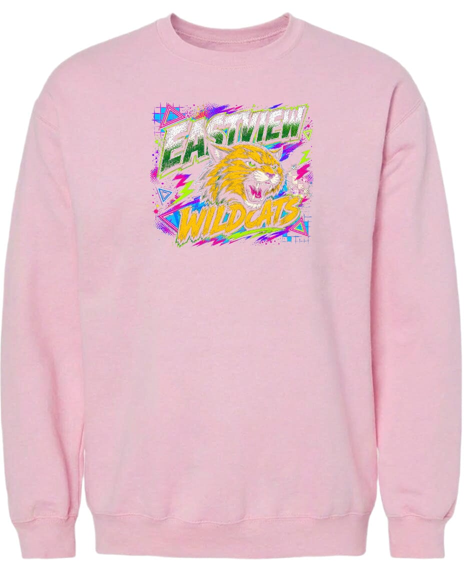 A pink sweatshirt with a graphic design featuring a yellow and orange cat with a fierce expression, surrounded by colorful geometric shapes and text.