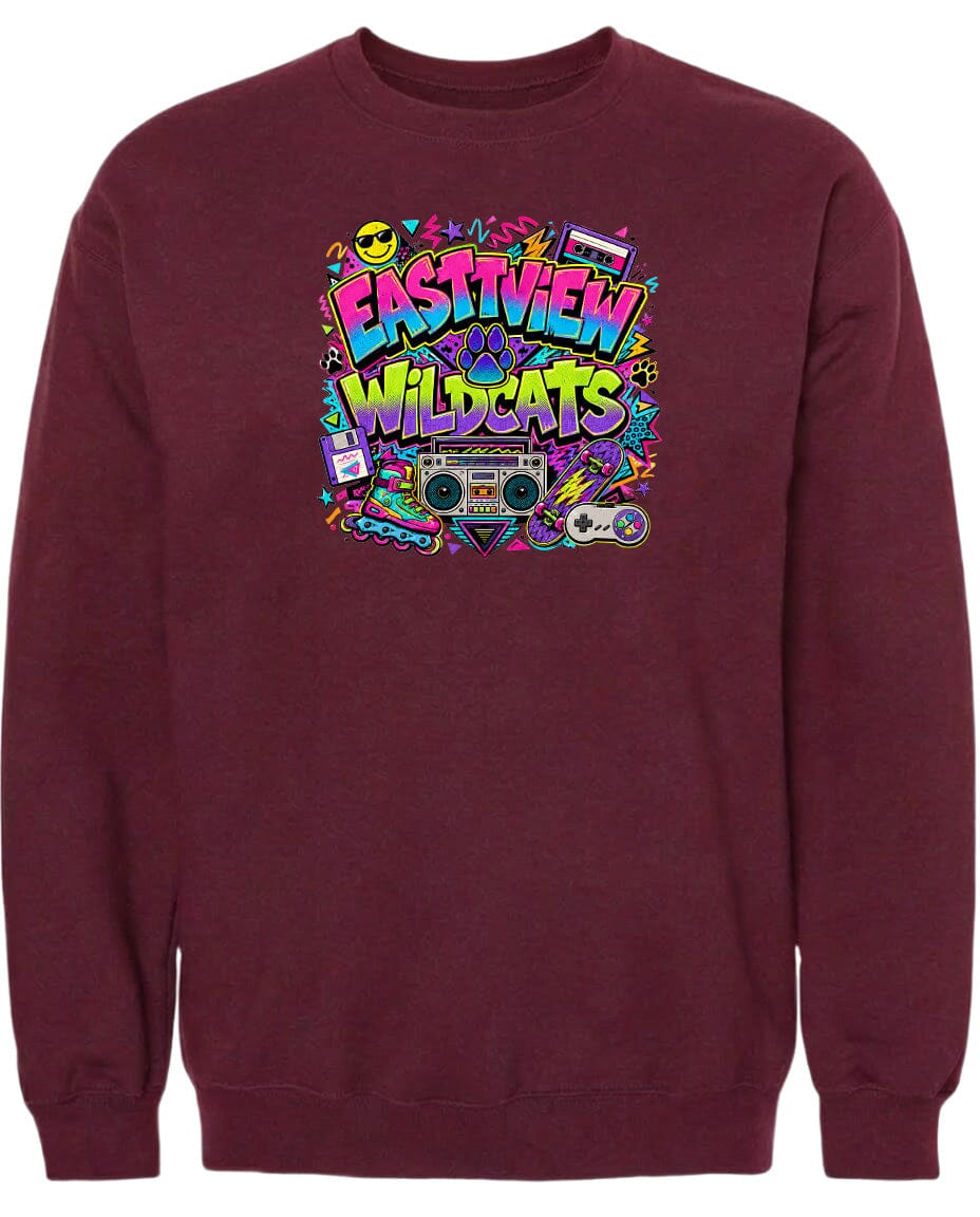 A burgundy sweatshirt with a colorful graphic design featuring the text "EASTVIEW WILDCATS" surrounded by various icons and elements, such as a boombox, a skateboard, and a peace sign.
