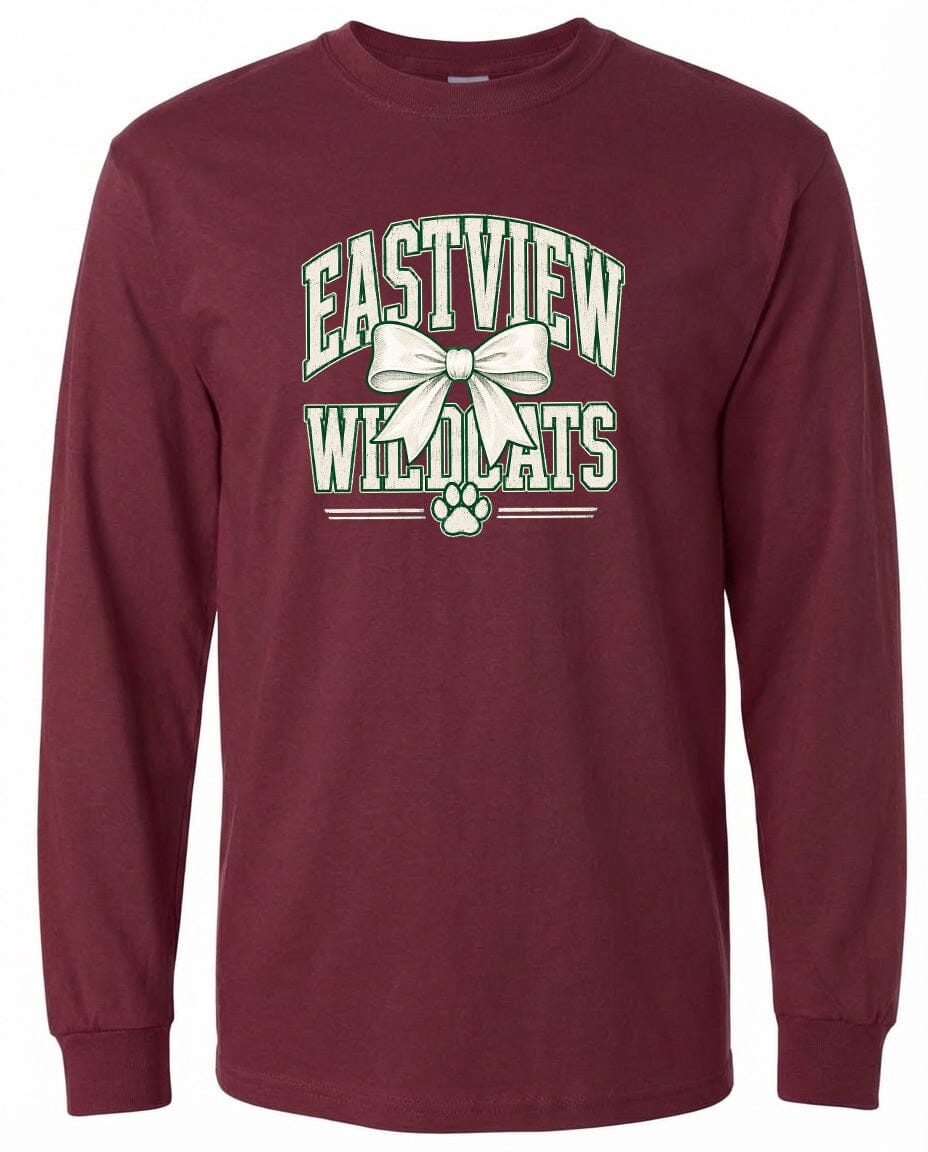 A burgundy long-sleeved t-shirt with a graphic design featuring the text "EASTVIEW WILDCATS" and a white bow.