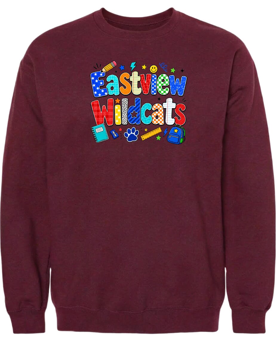 A burgundy sweatshirt with a colorful graphic design featuring the text "Eastview Wildcats" and various school-related icons such as a pencil, backpack, and calculator.