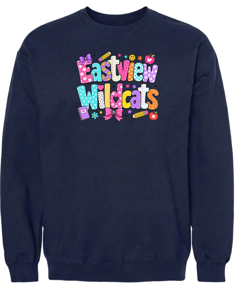 A navy blue sweatshirt with a colorful, playful design featuring the text "Eastview Wildcats" and various decorative elements such as hearts, stars, and flowers.
