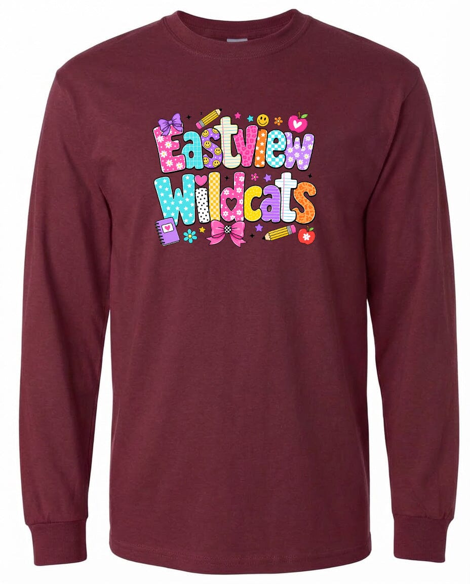 A burgundy long-sleeved t-shirt with a colorful graphic design featuring the text "Eastview Wildcats" in a playful, cartoon-like font.
