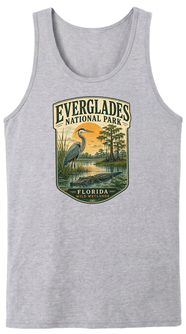 A gray tank top with a graphic design depicting a bird standing in a marshy area with trees and a sunset in the background.