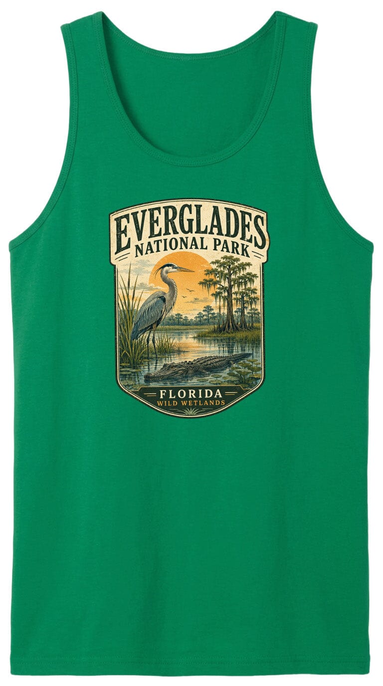 A green tank top with a graphic design depicting a bird standing in a marshy area with trees and a sunset in the background.