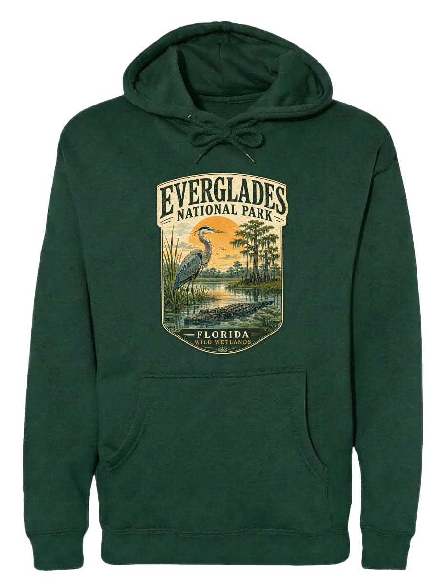 A green hoodie with a graphic design depicting a bird, likely a heron, standing in a natural setting with trees and a body of water.
