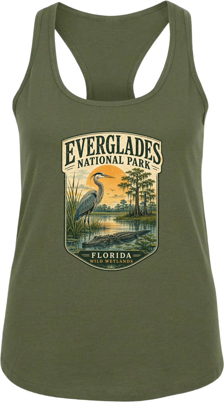 A green tank top with a graphic design depicting a bird, a sunset, and a body of water, along with the text "EVERGLADES NATIONAL PARK FLORIDA" printed on it.