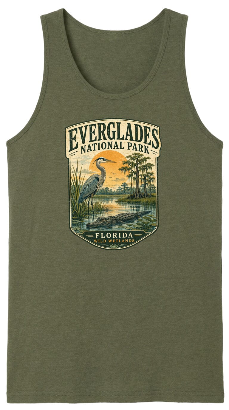 A green tank top with a graphic design depicting a bird standing in a marshy area with a sunset in the background.